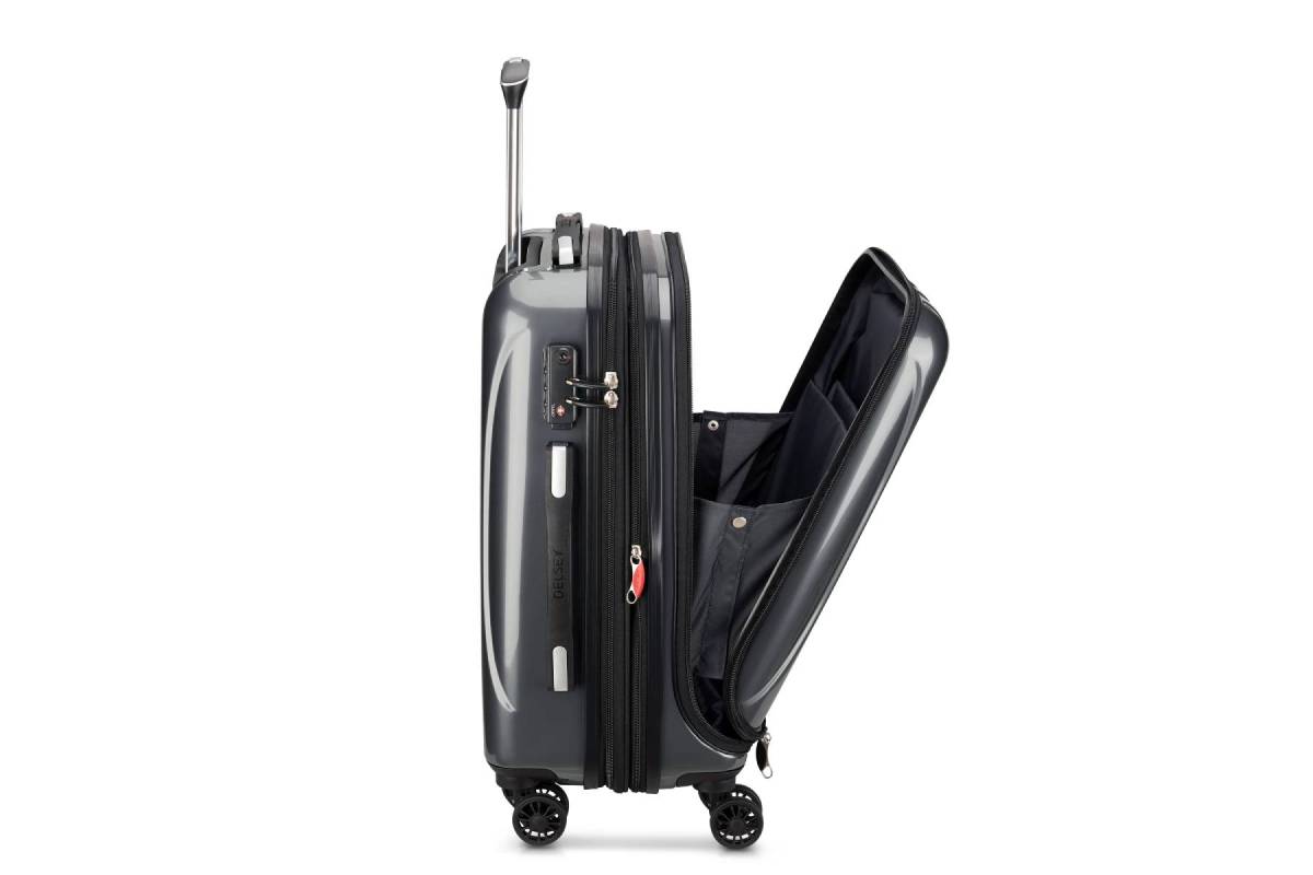 A gray hard-shell suitcase with wheels, partially opened to reveal a spacious interior and multiple compartments.