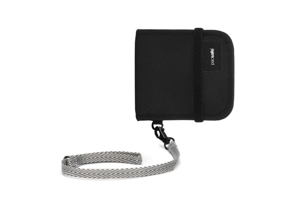 Black wallet with a gray and white patterned strap, featuring a zipper closure and a small pacsafe logo on the side.