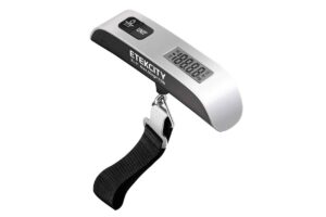 Digital luggage scale with a silver body, displaying weight in kg/lb, featuring a strap and buttons for power and unit change.