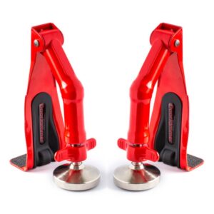 Two red door jammers with adjustable bases to hold doors securely in place on various surfaces.