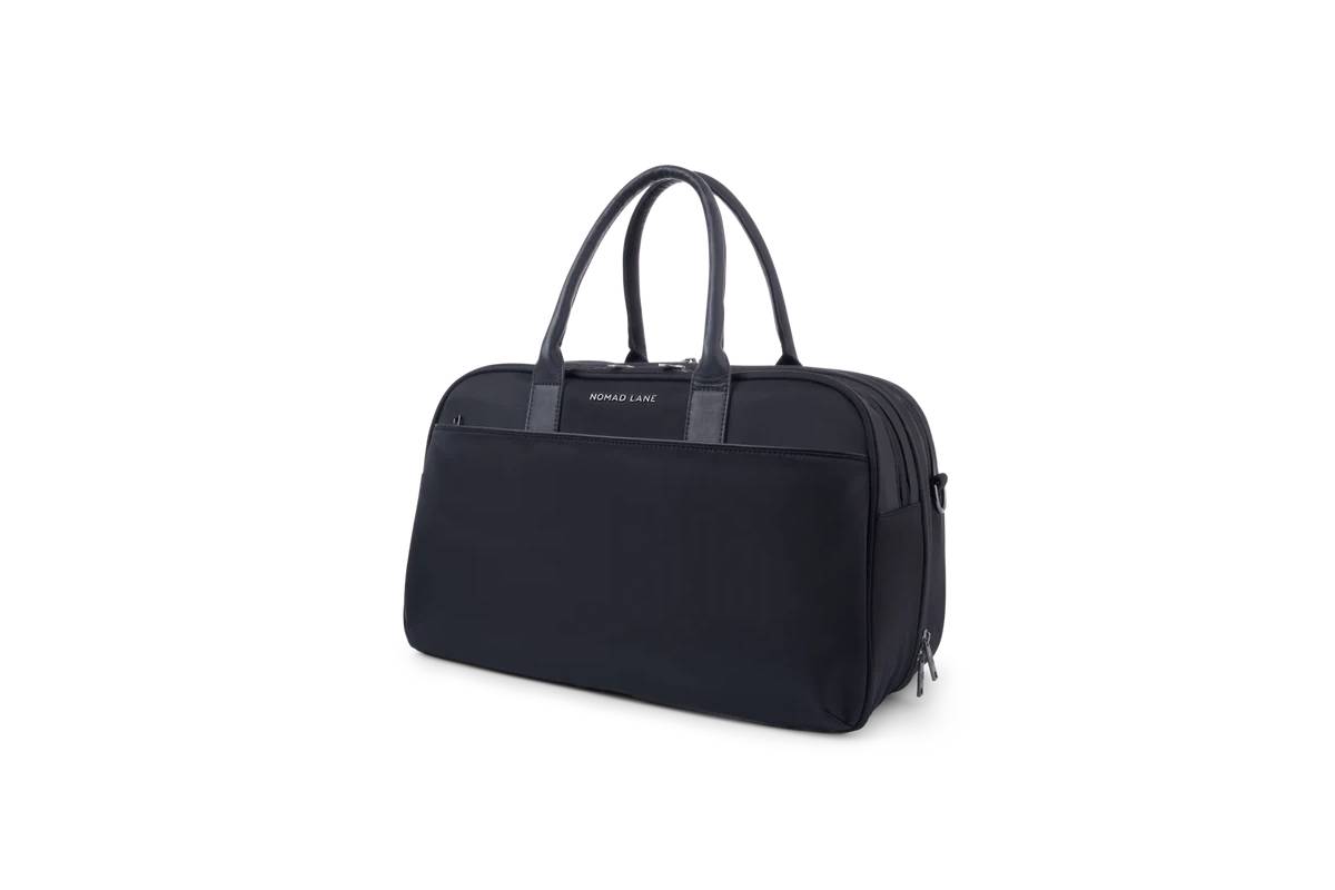 Stylish black travel bag with dual handles and a front pocket, featuring the Nomad Lane logo on the top.